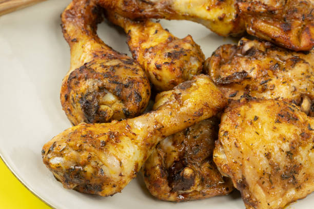 istock marinated chicken pieces, close-up, on a plate 2154966838
