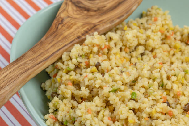 dish of cooked cereals (wheat, lentils, barley, peas), top view, close-up