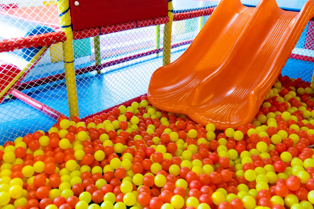 Playground with colorful balls and slide