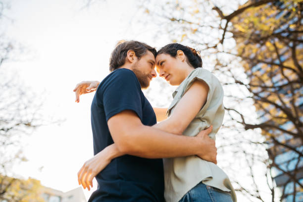 istock Couple embracing on the street 2154968662