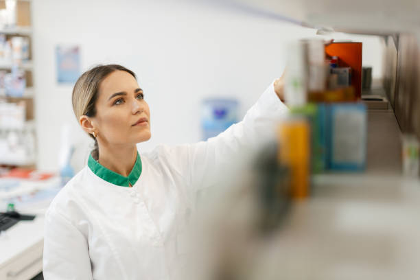 istock Young woman pharmacist at her workplace 2154969299
