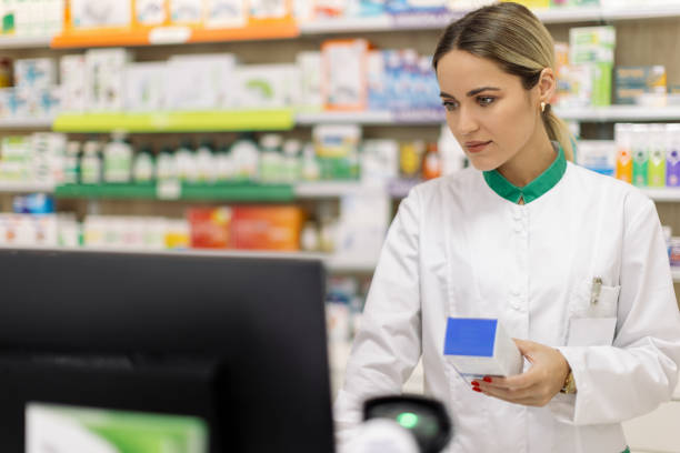 istock Young woman pharmacist at her workplace 2154969300