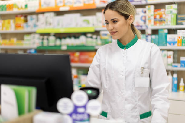 istock Young woman pharmacist at her workplace 2154969331