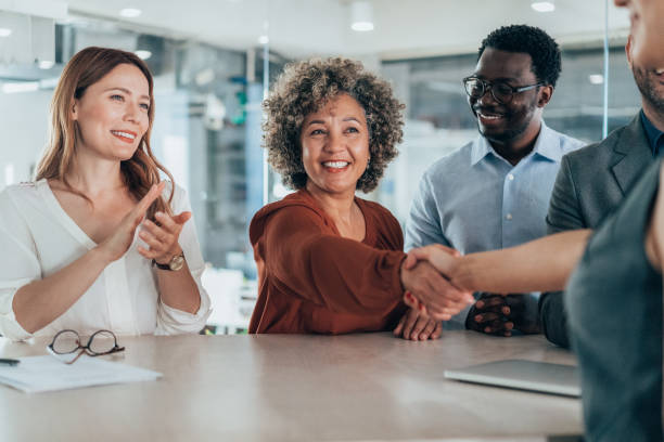 istock Shaking hands with new colleague 2154969744