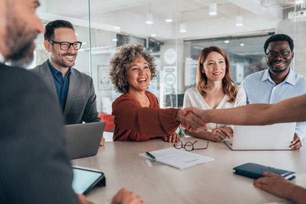 istock Shaking hands with new colleague 2154969746