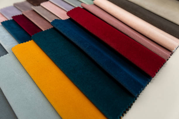 istock upholstery a fabric samples on grey sofa, concept of renovation 2154970495