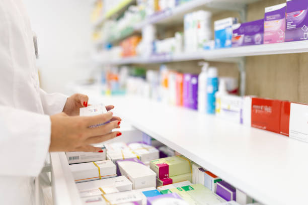 istock Young woman pharmacist at her workplace 2154970569