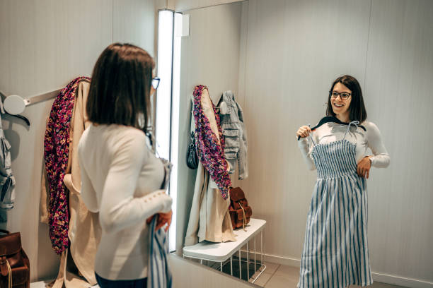 istock Woman trying clothes in a fitting room 2154971499