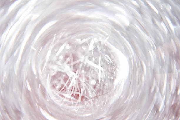 Light white tinsel background with bokeh and highlights suitable for Christmas. High quality photo.