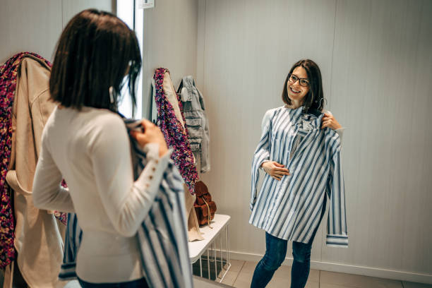 istock Woman trying clothes in a fitting room 2154972169