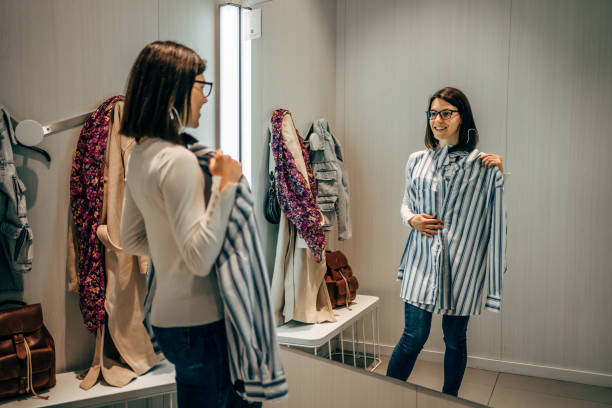 istock Woman trying clothes in a fitting room 2154972225