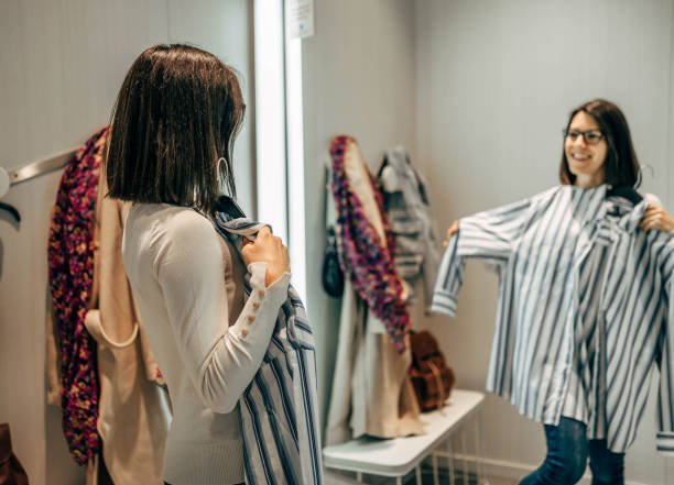 istock Woman trying clothes in a fitting room 2154972248