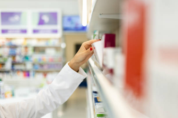 istock Young woman pharmacist at her workplace 2154972342