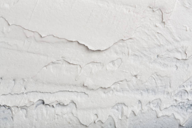 istock Structural plaster white on a black background. White Cream. paint smear. Plasticine 2154972431