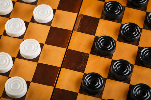 istock checkerboard with checkers. Game concept. Board game. Hobby. checkers on the playing field for a game. 2154972779