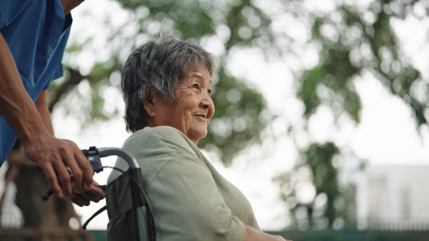 istock Elderly in a wheelchair being cared for a nurse. 2154973537