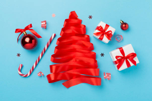 istock Creative handmade christmas tree with decor on color background, top, view 2154973768