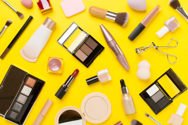 istock Flat lay with makeup products and tools on color background 2154974558