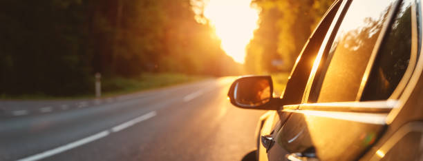 istock Panoramic view of the car on the asphalt highway on sunset. 2154975155