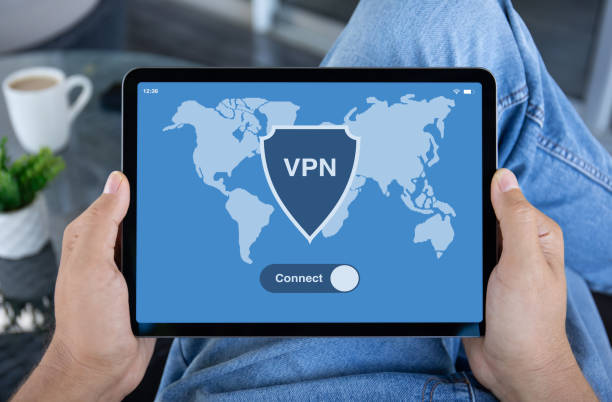 istock male hands hold computer tablet with app vpn on screen 2154976582