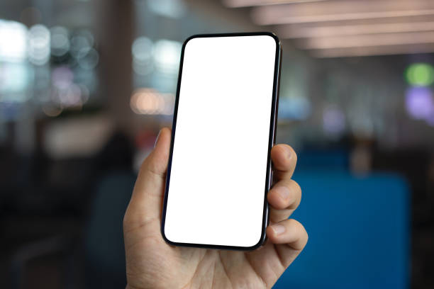 istock Male hand holding phone with isolated screen blue office background 2154976925