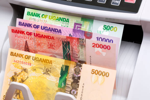 istock Ugandan shilling in a counting machine 2154977045