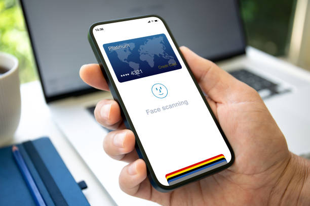 istock man hand holding phone with application face scanning id 2154977370