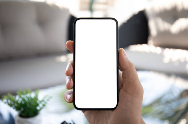 istock Man hand hold phone with isolated screen background hotel cafe 2154977550