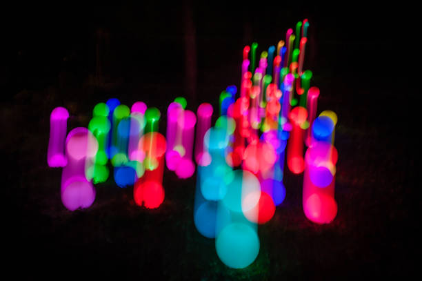 Light painting abstract background. Colorful light balls, long exposure. Abstract butterfly against a black background. Zoom burst effect.