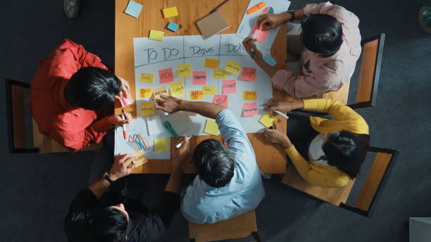 istock Top view of diverse people writing and making scrum task board. Convocation. 2154980439