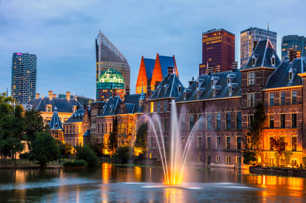 The Hague, Netherlands - April 17, 2023: Facade of Binnenhof - Dutch Parliament with Hofvijver pond, The Hague, The Netherlands;