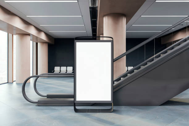 istock A blank advertising lightbox stand in a modern interior near a staircase, on a clean background, concept of branding promo. 3D Rendering 2154982809
