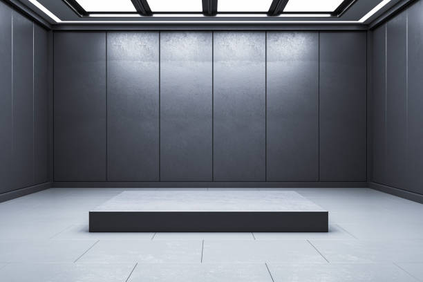 istock A modern interior with a blank pedestal in an empty room, set against a dark textured background, ideal for product presentation. 3D Rendering 2154982820