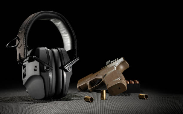 istock Semi auto 9 mm pistol and hearing protection 2154986612