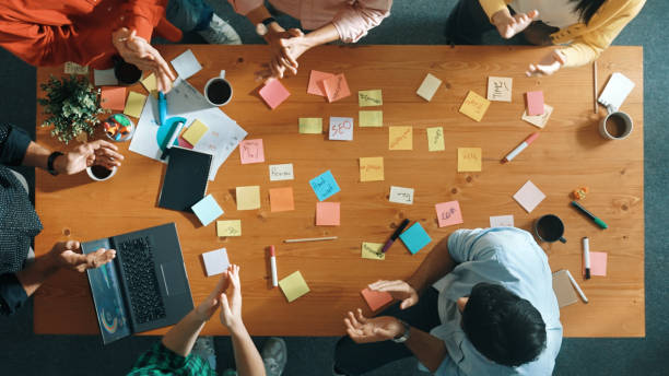 istock Top view of skilled business people discuss plan at meeting room. Convocation. 2154987010