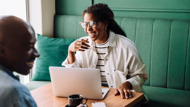 istock Happy black couple enjoying a fun conversation at a cafe 2154987156