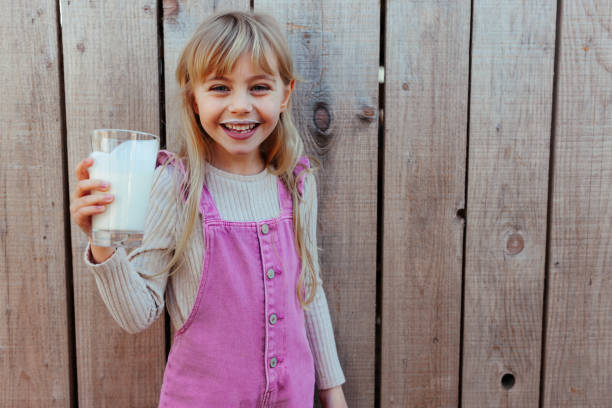 istock Child with milk at a barn 2154987162
