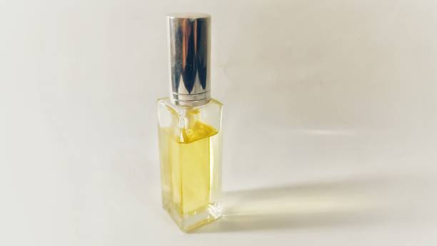 istock Yellow women perfume isolated on white background 2154990387