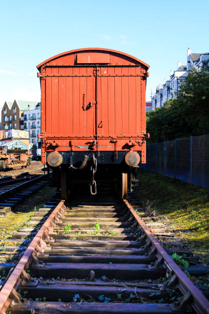 Bristol, England- March 29, 2024: Old abandoned wagons and machinery on tracks in Bristol Harbour Railway