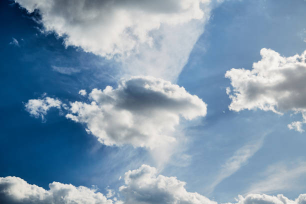white cloud in the blue sky, illuminated by sunlight and white mist
