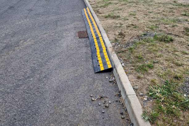 istock safety crossing wedge made of plastic with reflective elements. anti-skid plastic approach over the curb to the construction site 2154992664