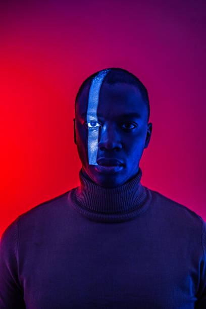 istock Strip of light on man's face 2154992730