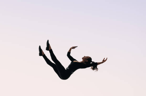 istock Falling into the digital depth: Woman holding cellphone, endlessly scrolling through social media 2154993814