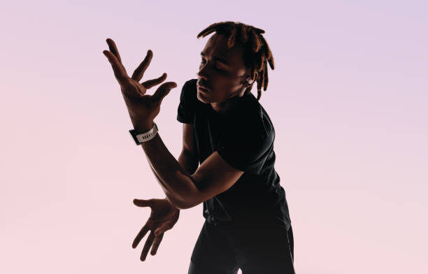 istock Silhouette of gen z dancer moving to wireless beats 2154993871