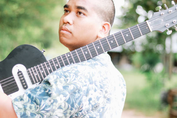 istock Thai male guitarist 2154994170