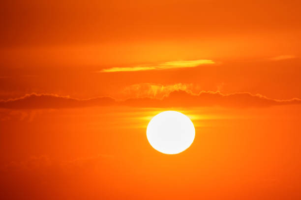 The sunset's light filtered through the clouds, transforming the landscape into a breathtaking view.