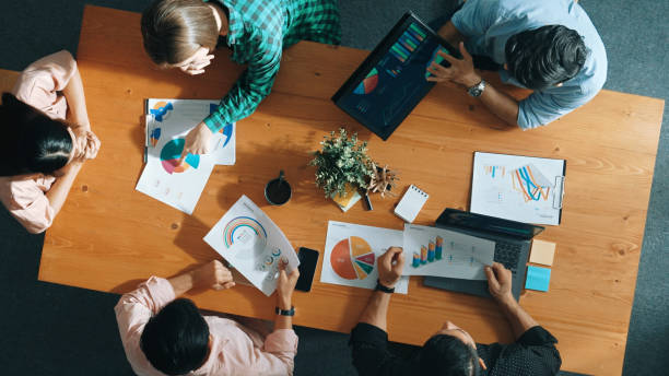 istock Top view of manager use tablet to analyze data and financial chart. Convocation. 2154996913