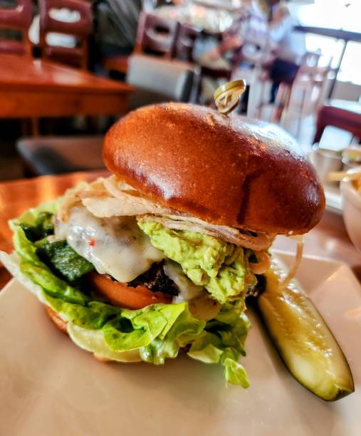 istock Pub Cheeseburger with Guacamole and Poblano Chili Pepper 2154997570