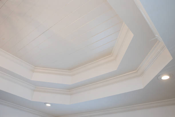 istock An ornate double 2 layer white tray ceiling master bedroom of an older home with a classic style 2154999577