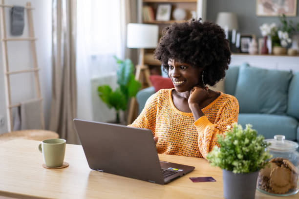 istock Smiling woman online shopping 2154999733
